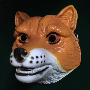 A plastic fox mask that covers the front of the face