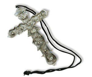 Ornate large silver coloured cross on a black cord