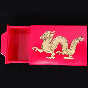 Red box with gold dragon.  4½” x 3" x 1½”  easy to do magic trick 