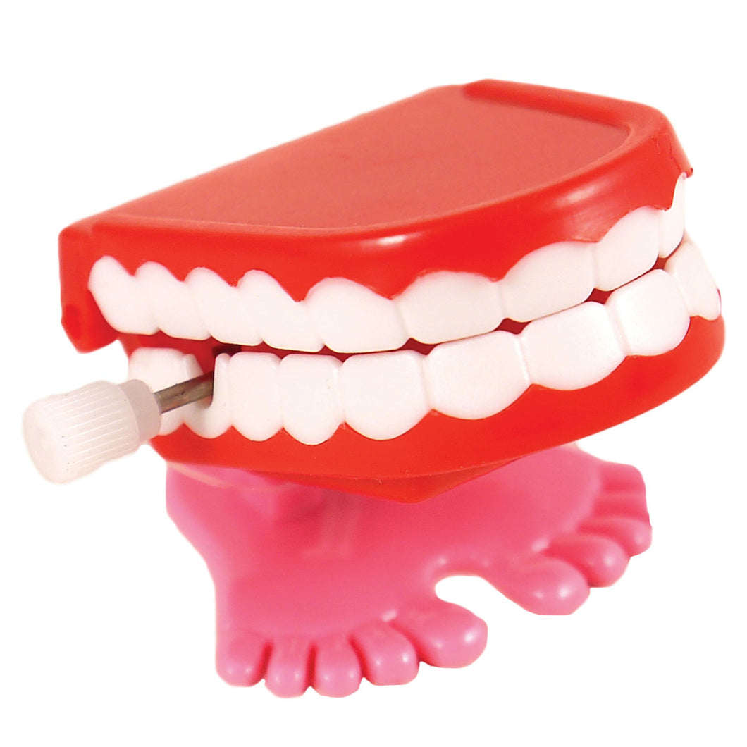 Small plastic set of teeth, red with white teeth, that you wind up. They have small feet and hop as they chatter.
