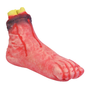 Looks like a real severed foot with bone coming from the ankle and blood dribbling over foot which is a reddish colour.